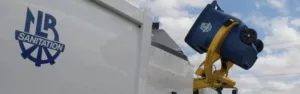 photo of sanitation truck picking up trash bin