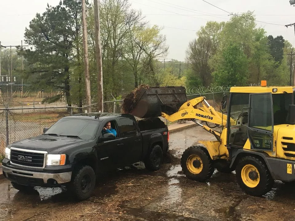photo of pick up truck and front end loader