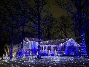 photo of house with lights and snow