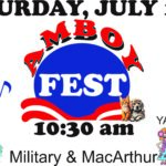 Colorful flyer announcing Amboy Fest on Saturday, July 11th at 10:30 a.m. The central logo features a blue circle with red wave accents and white text reading “FEST,” with “AMBOY” in red letters above. Surrounding graphics include a food truck labeled “FOOD,” musical notes, raffle tickets beside the word “PRIZES!,” cartoon people at a “YARD SALE” table, and small images of a cat and dog. The location “Military & MacArthur” appears at the bottom.
