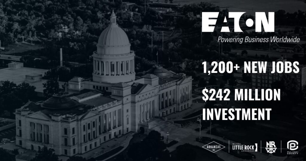 Aerial view of the Arkansas State Capitol building in Little Rock with white text overlay announcing Eaton’s investment. The text reads “Eaton – Powering Business Worldwide. 1,200+ New Jobs. $242 Million Investment.” Logos for Arkansas Inc, Metro Little Rock, North Little Rock, and Pulaski County appear at the bottom.