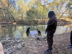 students cleaning creek