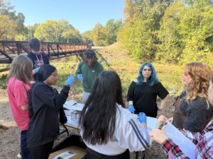 students cleaning creek
